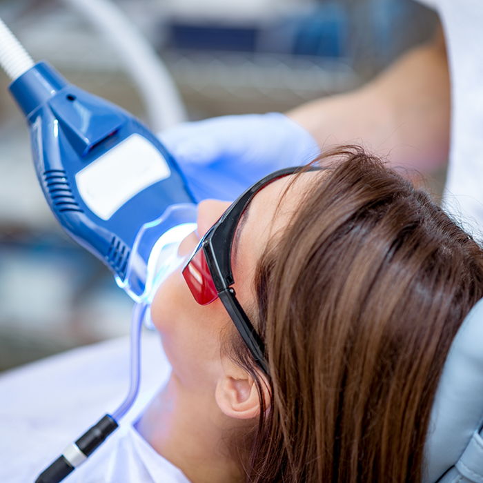 Woman receiving in-office teeth whitening