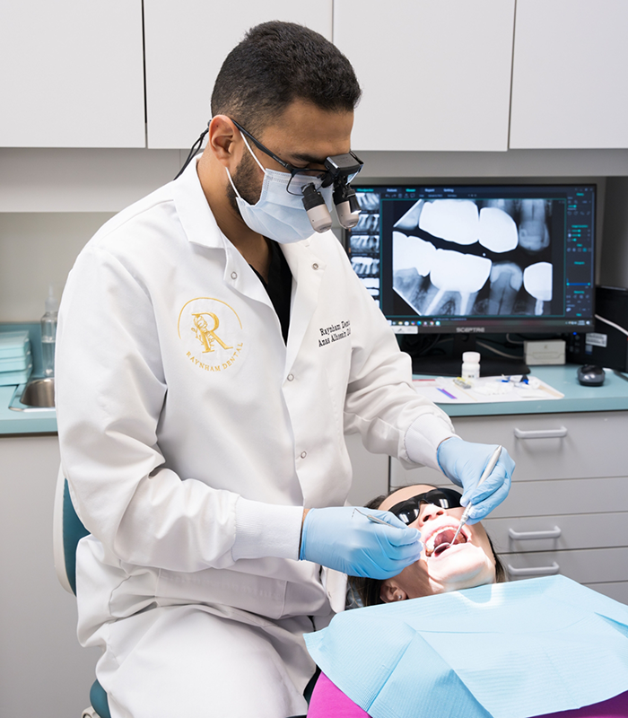 Dentist performing checkup on patient