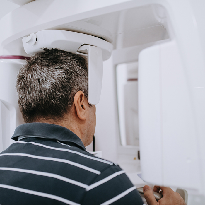 Man with digital X-ray machine