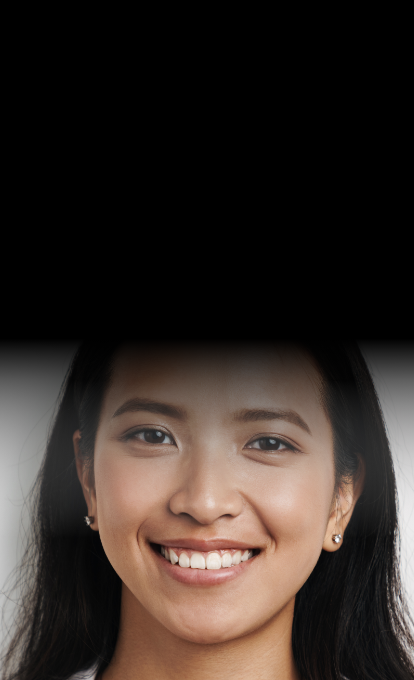 Woman smiling after visiting dentist in Raynham