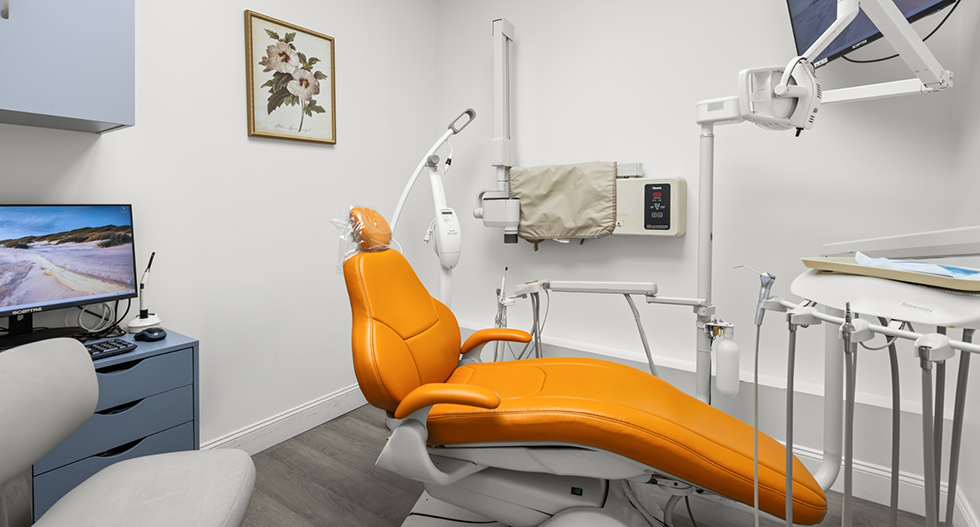 Orange chair in dental treatment area