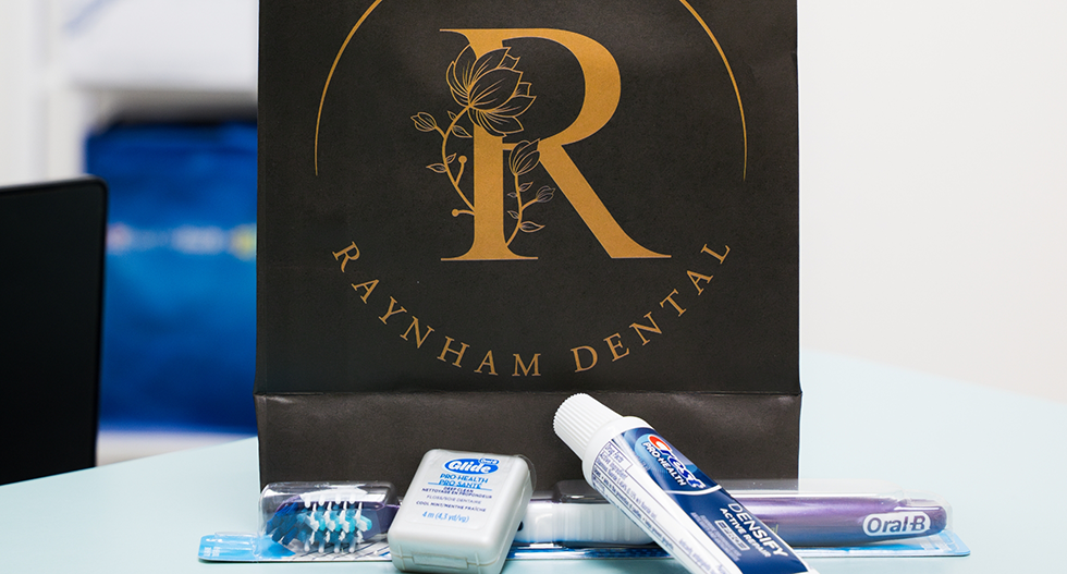 Raynham Dental logo and dental hygiene products
