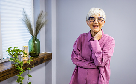Senior woman with glasses smiling