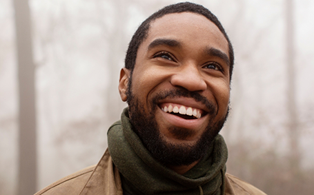 Close-up of man with scarf smiling