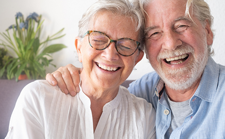Senior couple hugging and smiling